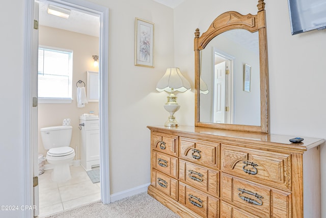 bathroom with tile patterned floors, toilet, and vanity