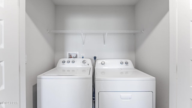 washroom featuring washer and dryer