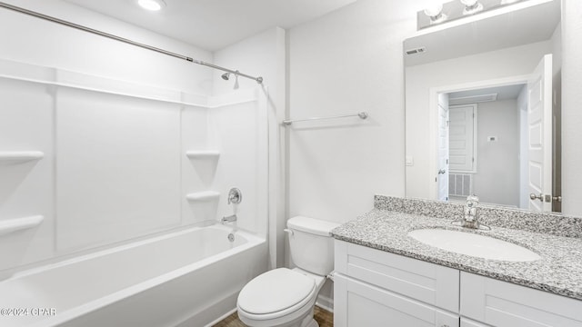 full bathroom featuring shower / bathing tub combination, vanity, and toilet