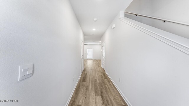 corridor with light wood-type flooring