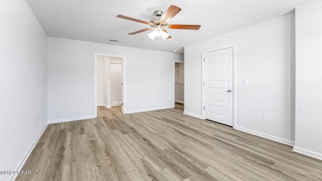 unfurnished bedroom with ceiling fan and light hardwood / wood-style floors