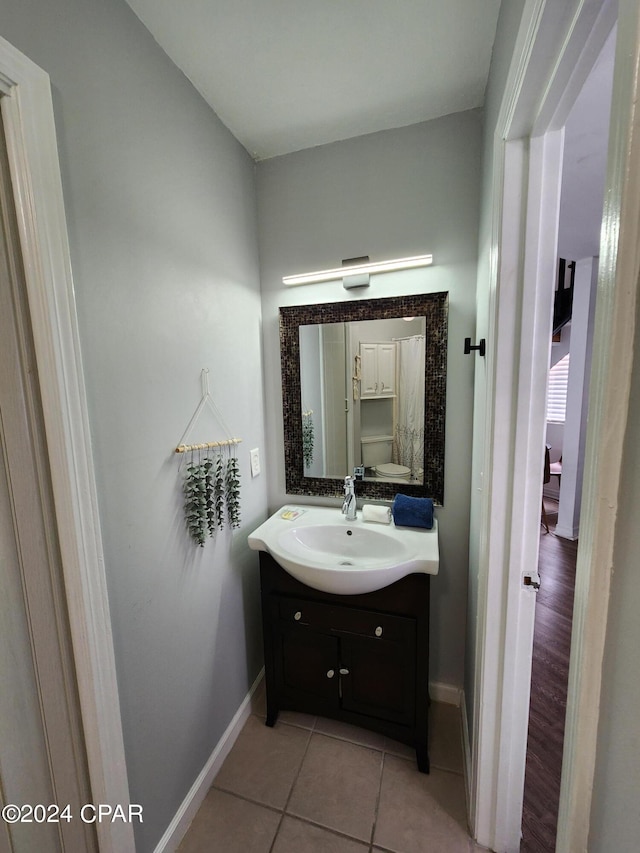 bathroom with tile patterned floors and vanity