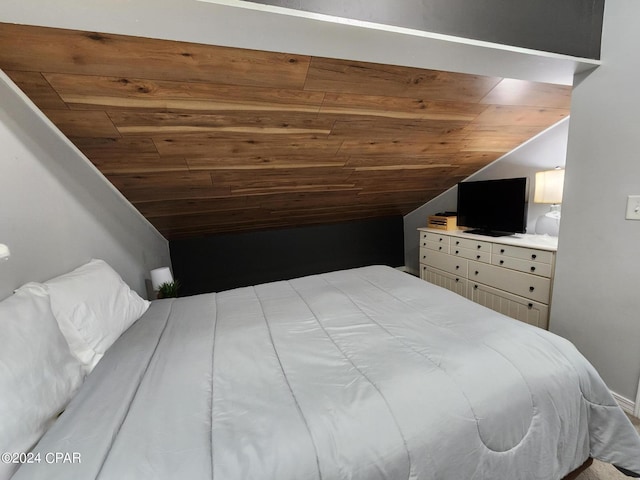 bedroom featuring wooden ceiling and vaulted ceiling