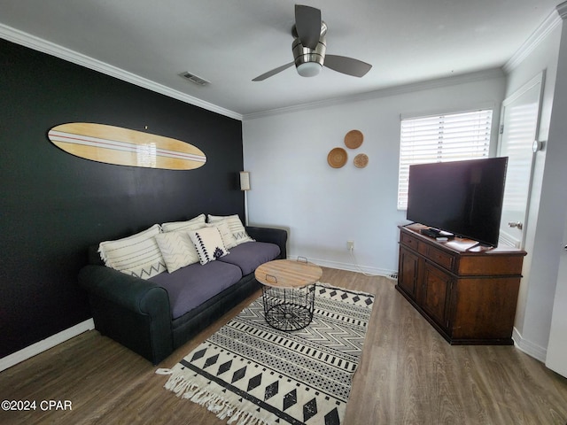 living room featuring ceiling fan, wood-type flooring, and ornamental molding