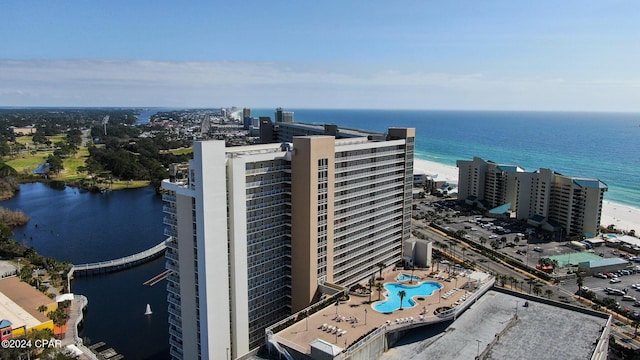 aerial view with a water view and a beach view