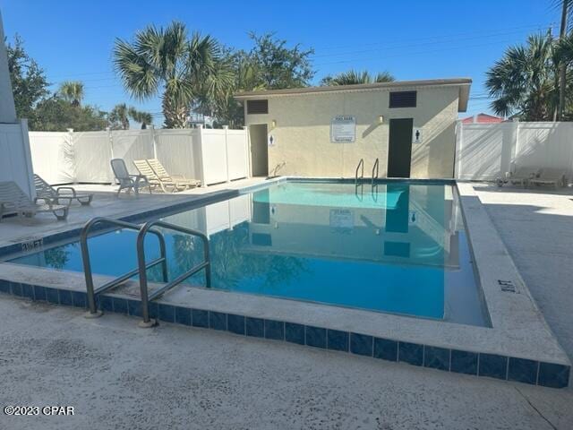 view of swimming pool featuring a patio area