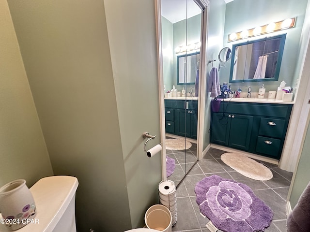 bathroom with tile patterned flooring and vanity