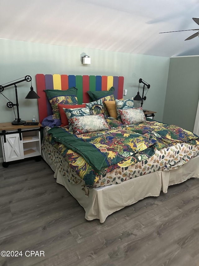 bedroom with hardwood / wood-style flooring and ceiling fan