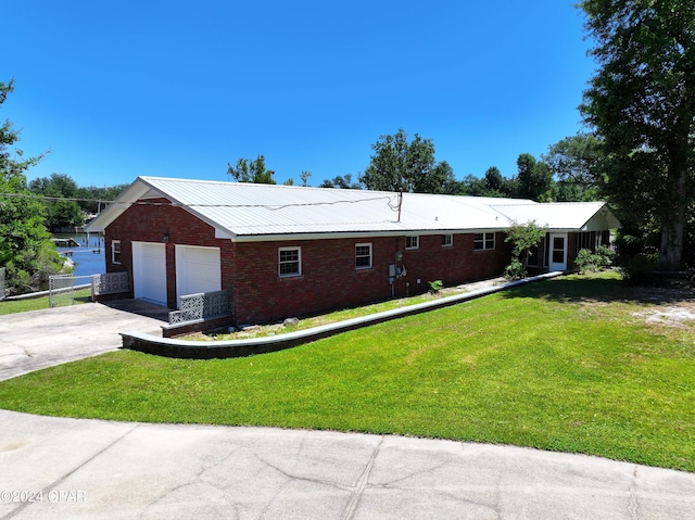 view of home's exterior with a yard and a garage