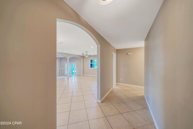 hall featuring light tile patterned floors