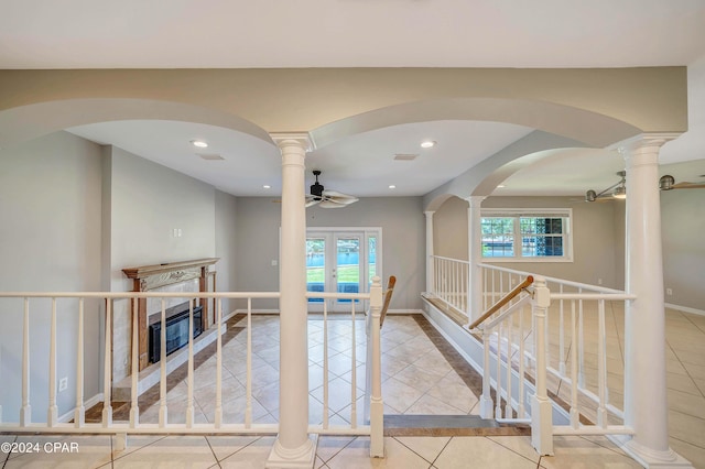 interior space featuring ceiling fan, french doors, and light tile patterned flooring