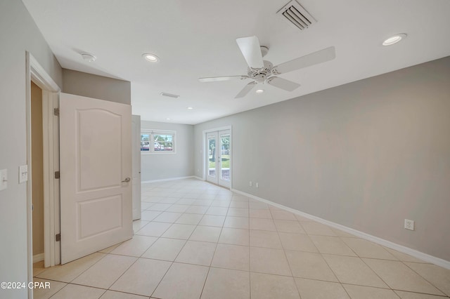 tiled spare room with french doors and ceiling fan