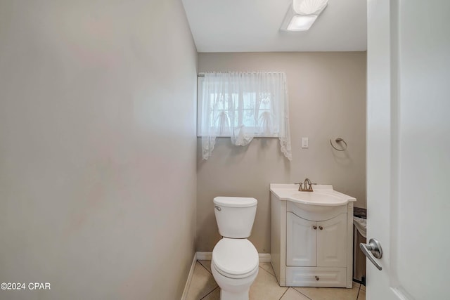 bathroom with tile patterned floors, vanity, and toilet