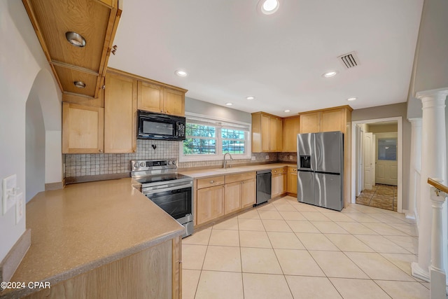 kitchen with light brown cabinets, backsplash, black appliances, sink, and light tile patterned floors