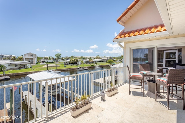 balcony featuring a water view