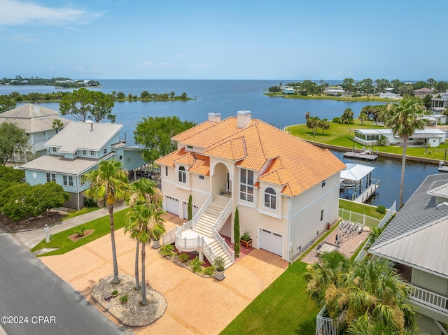 birds eye view of property with a water view