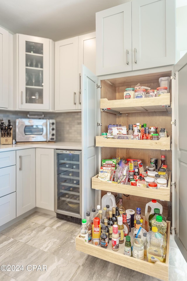 pantry featuring wine cooler