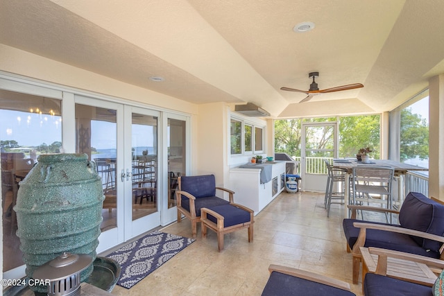 view of patio / terrace featuring ceiling fan and french doors