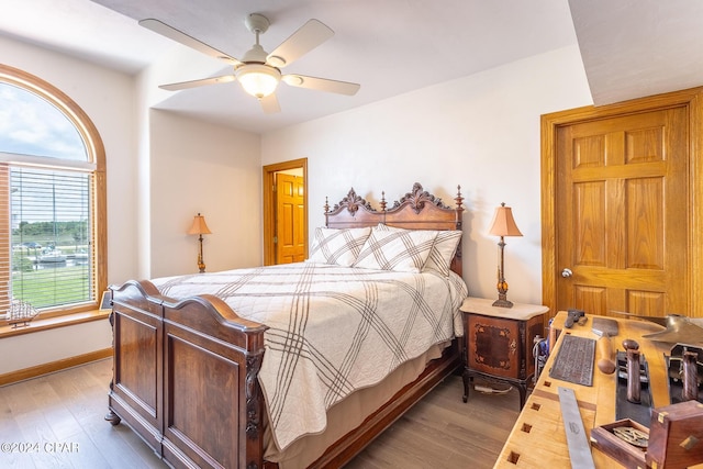 bedroom featuring ceiling fan and light hardwood / wood-style flooring