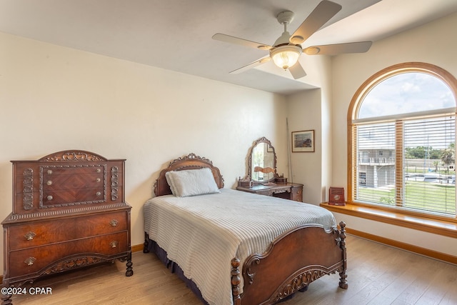 bedroom featuring ceiling fan and light hardwood / wood-style flooring