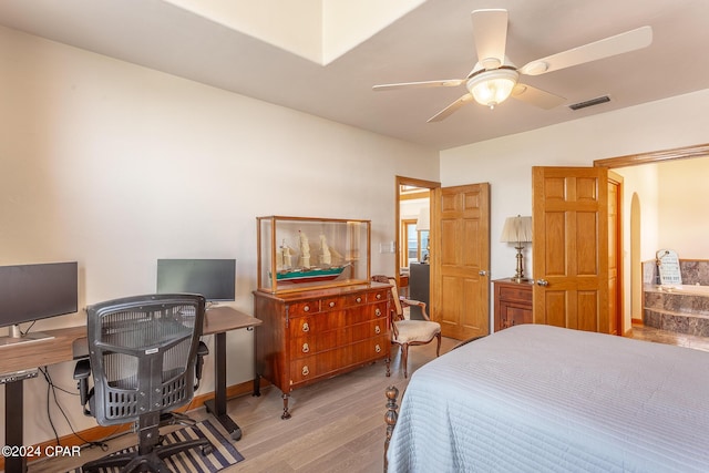 bedroom with light wood-type flooring and ceiling fan