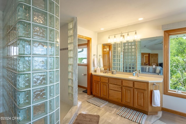 bathroom featuring vanity and walk in shower