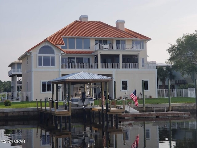 back of house featuring a water view