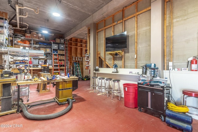 interior space featuring a workshop area and concrete flooring