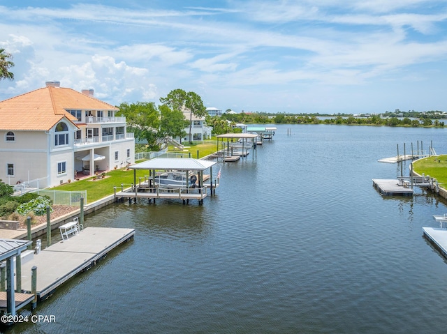 view of dock featuring a balcony and a water view