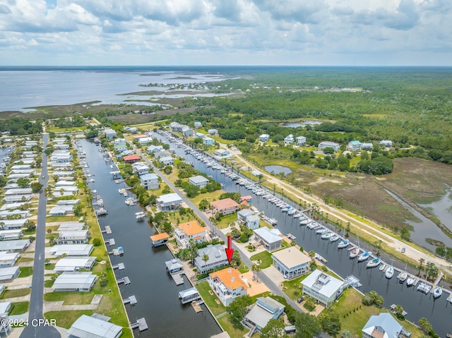 birds eye view of property with a water view