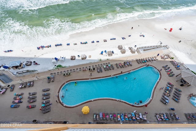 bird's eye view with a beach view and a water view