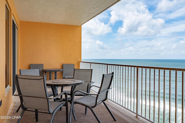 balcony featuring a water view