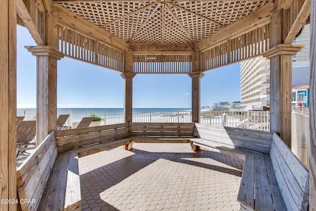 view of patio with a gazebo and a water view