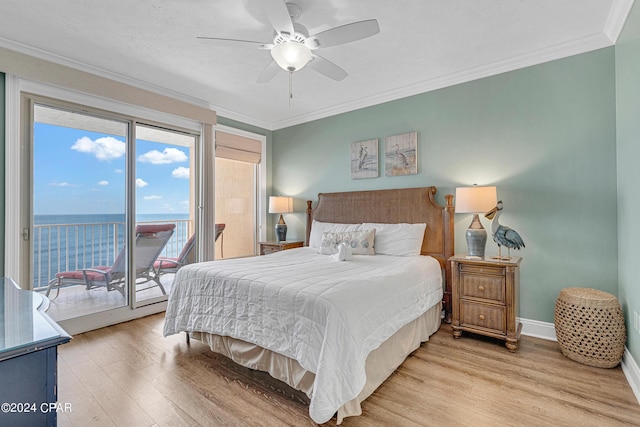 bedroom with light wood-style flooring, baseboards, ornamental molding, and access to outside