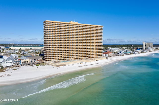 aerial view featuring a water view and a beach view