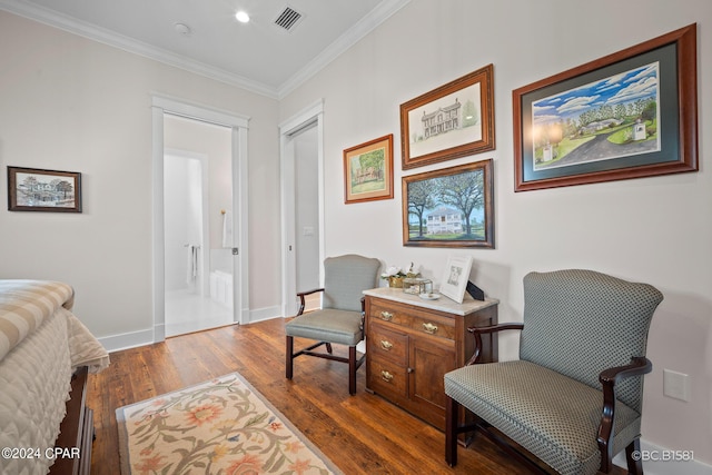 sitting room featuring hardwood / wood-style flooring and ornamental molding