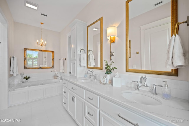 bathroom with tile patterned flooring, vanity, an inviting chandelier, and a bathtub