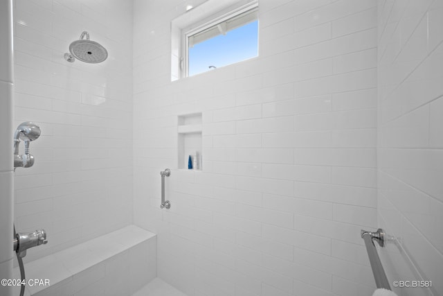 bathroom featuring a tile shower