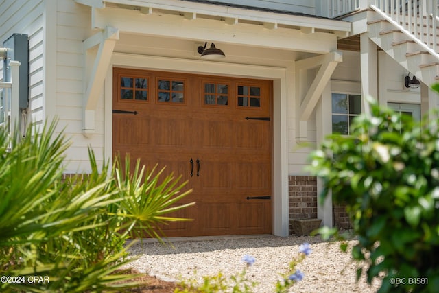 view of exterior entry featuring a garage