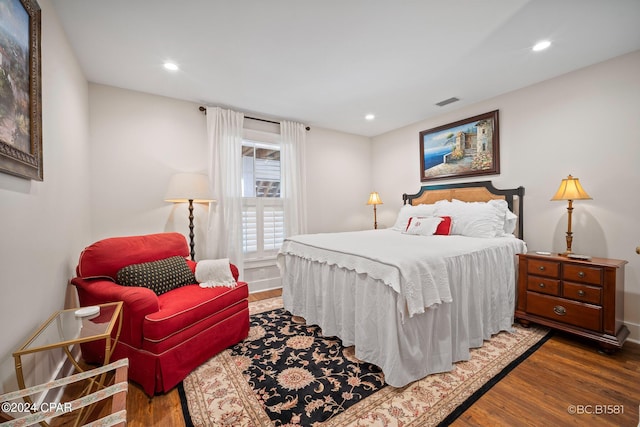 bedroom featuring dark hardwood / wood-style floors