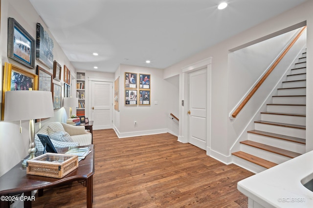 living area with hardwood / wood-style flooring