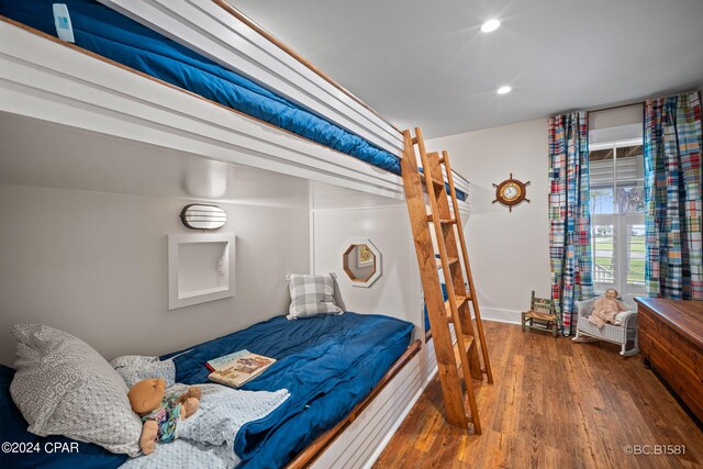 bedroom featuring dark wood-type flooring