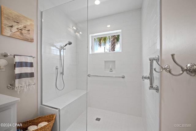 bathroom with a tile shower