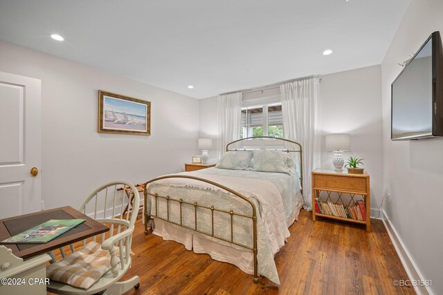 bedroom featuring dark wood-type flooring