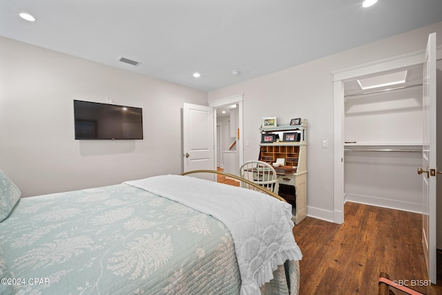 bedroom featuring a closet and dark hardwood / wood-style floors