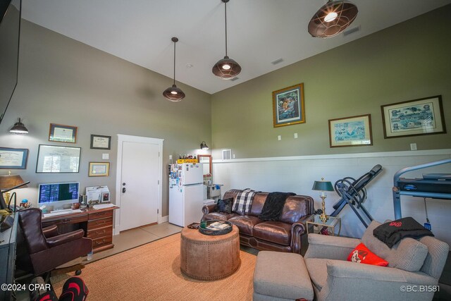 tiled living room featuring high vaulted ceiling