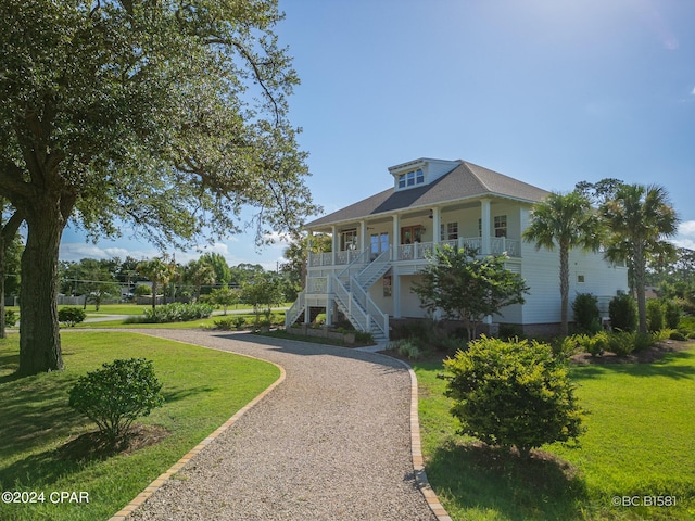 view of front facade with a porch and a front yard