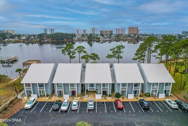 birds eye view of property featuring a water view