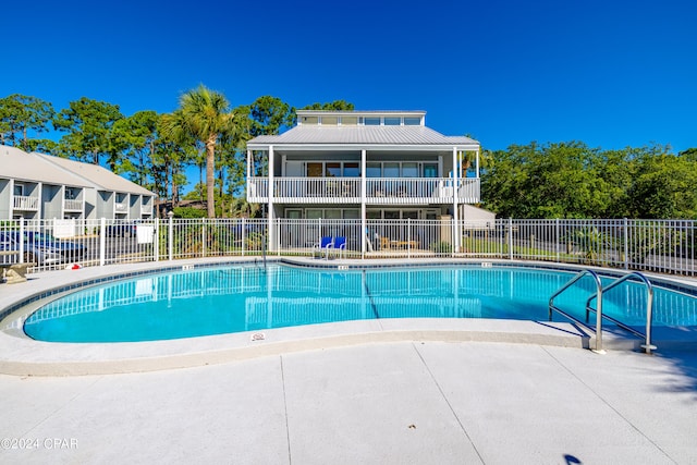 view of pool featuring a patio