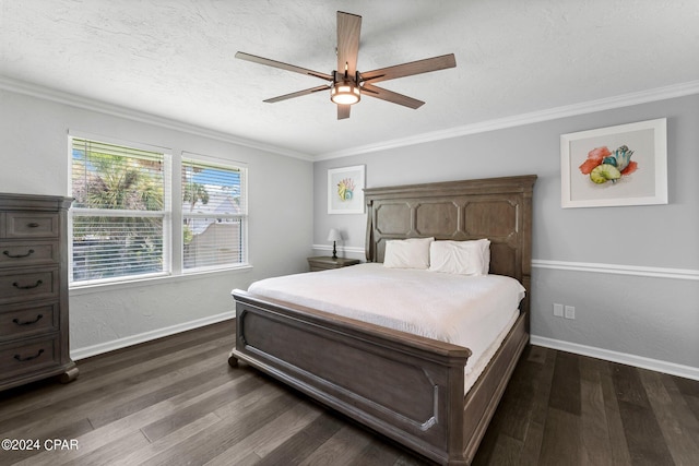 bedroom with dark wood-type flooring, ornamental molding, ceiling fan, a textured ceiling, and baseboards